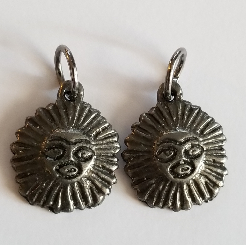 Two vintage sun face charms pendants dark silver tone metal celestial star